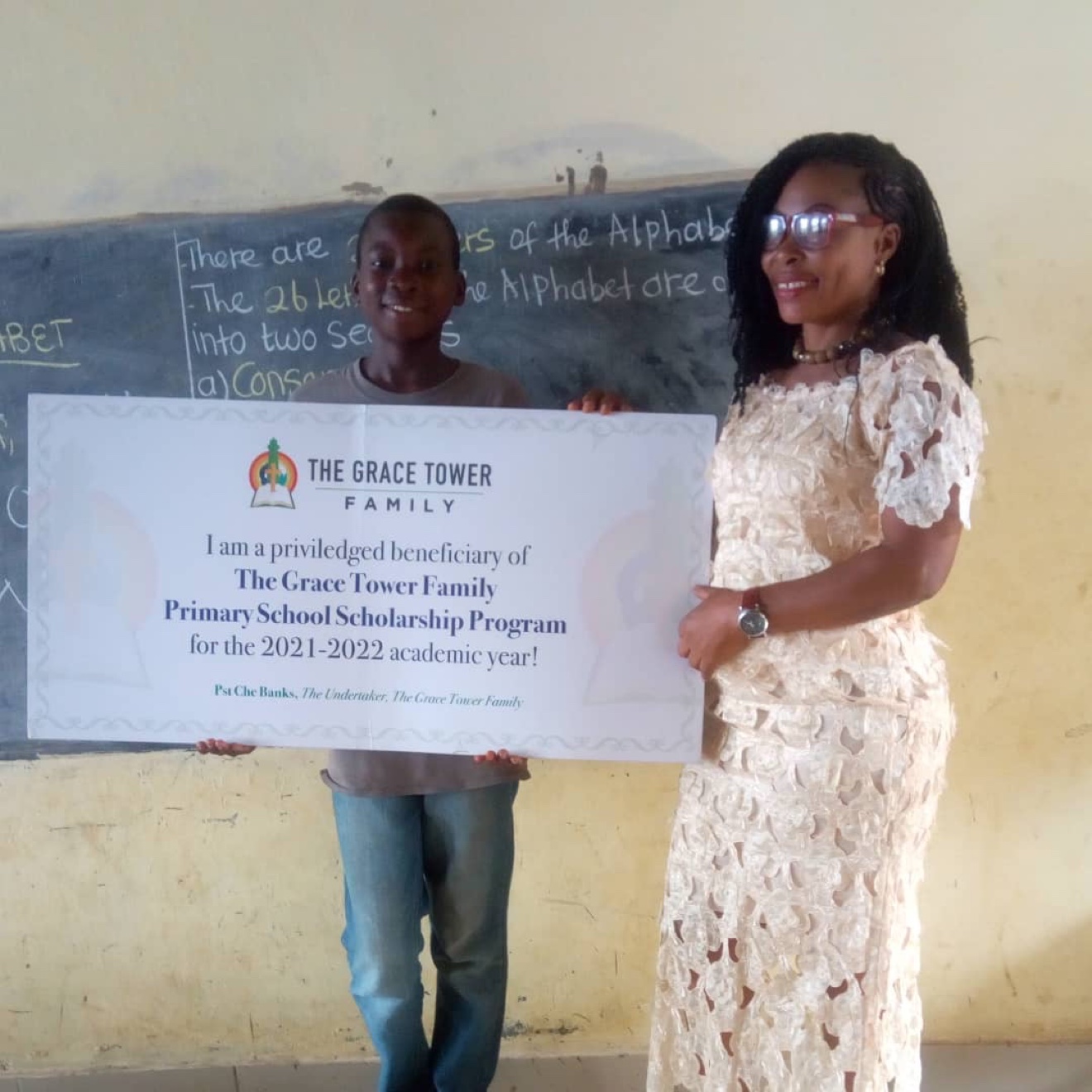 Grace Tower Family scholarship beneficiary with teacher
